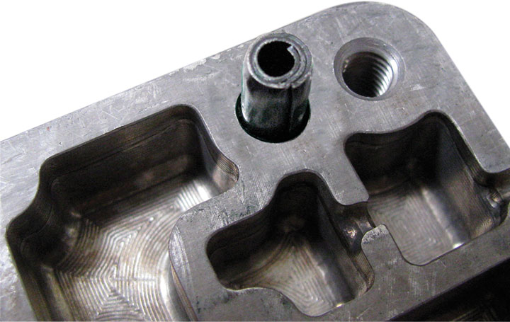 app coiled pin automotive valve body close up top